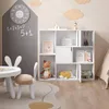 A children's room with a bookshelf, table, and chairs. Produktbild-Vorschau