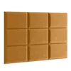A wall of nine padded, square panels arranged in a 3x3 grid. The panels are a warm, light brown or tan color and have a slightly textured appearance, resembling leather or suede. They appear to be mounted on a wall and are lit to cast subtle shadows betwee Anteprima dell’immagine prodotto
