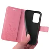 A hand holding a pink floral flip phone case open, revealing the black interior where a phone would be placed. Produktbild-Vorschau