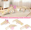 A collage of images showing a wooden indoor climbing structure for children in various configurations, set against a light-colored rug and a room background. Voir les images du produit
