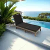 A lounge chair by an infinity pool overlooking the ocean. Voir les images du produit