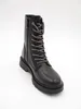 A black combat boot is shown against a white background. Produktbild-Vorschau