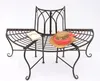 A metal garden bench with a book and a hat on it, set against a white background. Náhled obrázku produktu