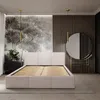 A bedroom scene with a bed, nightstand, and vanity. Produktbild-Vorschau