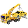 A yellow toy tow truck is lifting a yellow toy taxi cab. Anteprima dell’immagine prodotto