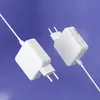 Two white USB-C power adapters are shown floating against a blue background. Produktbild-Vorschau