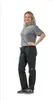 A woman is standing and posing in a studio setting, wearing the product. Produktbild-Vorschau