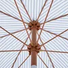 Close-up view of the internal structure of a striped umbrella. Produktbild-Vorschau