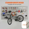 A wall-mounted storage system with various tools and a bicycle displayed. Podgląd zdjęcia produktu