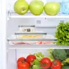Inside of a refrigerator with food items. Voir les images du produit