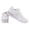 A pair of white Skechers sneakers are shown against a white background. One shoe is angled to show the side and laces, while the other is shown from the back. Voir les images du produit