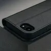A close-up shot of a black leather iPhone case, showing the camera cutout. Anteprima dell’immagine prodotto