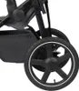 Close-up view of a stroller wheel and part of the frame. Produktbild-Vorschau