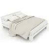 A white wooden double bed with beige bedding, shown from a diagonal angle on a white background. Náhled obrázku produktu