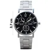 A close-up studio shot of a silver analog wristwatch with a black dial. Produktbild-Vorschau