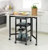A kitchen cart with a fold-out table, set up in a kitchen environment. Produktbild-Vorschau