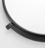 A close-up view of a black metal ring with a small adjustment knob. Produktbild-Vorschau