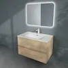 A bathroom vanity with a sink and mirror mounted on a gray wall. Produktbild-Vorschau