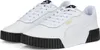 A pair of white Puma Carina 2.0 sneakers with black soles and gold Puma branding. Produktbild-Vorschau