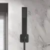 A black hand shower head mounted on a marble-patterned wall. Podgląd zdjęcia produktu