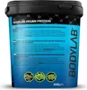 A close-up of a large plastic tub of BODYLAB Vegan Protein powder, showing the product label with nutritional information and branding. Produktbild-Vorschau