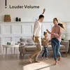 A family is dancing in a living room while a mini projector is on a side table. Produktbild-Vorschau
