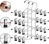A stack of metal hangers with clips for hanging clothes. Produktbild-Vorschau