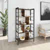 A bookshelf in a room with a plant and a sofa. Produktbild-Vorschau