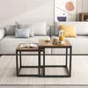 A living room scene with a couch, coffee tables, and artwork. Podgląd zdjęcia produktu