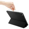 A hand is holding an Apple Pencil above a black iPad case. Podgląd zdjęcia produktu