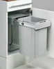A pull-out trash can system installed in a kitchen cabinet. Voir les images du produit