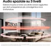 A living room scene with a TV, soundbar, and sofa, illustrating spatial audio. Voir les images du produit