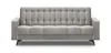 A studio shot of a gray sofa with tufted upholstery and black legs, presented against a white background. Produktbild-Vorschau