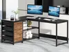 An L-shaped desk with two monitors, keyboards, and office supplies. Anteprima dell’immagine prodotto