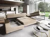 A modern living room with a large sectional sofa that has its sleeping and storage features exposed. Produktbild-Vorschau
