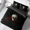 A bed with bedding featuring a skull and roses design. Produktbild-Vorschau