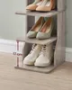 A close-up shot of a narrow, multi-tiered shoe rack with various shoes on each shelf. Náhled obrázku produktu