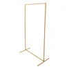 A gold-colored metal arch stand on a white background. Produktbild-Vorschau