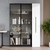 A modern living room with a display cabinet filled with decorative items and books. Produktbild-Vorschau