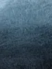 A close-up, textured view of a blanket. Produktbild-Vorschau