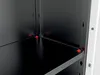 A close-up view of the interior corner of a storage cabinet, showing a shelf and its support pegs. Voir les images du produit