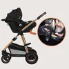 A stroller with a car seat attached, and an inset showing the car seat being placed in a car. Produktbild-Vorschau