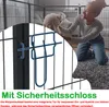 A woman is playing with a small white dog inside a playpen. Voir les images du produit