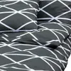 A close-up view of a grey duvet cover with a white geometric pattern. Produktbild-Vorschau
