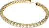 A close-up studio shot of a gold tennis bracelet with clear stones, displayed on a white background. Anteprima dell’immagine prodotto