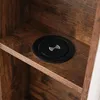 A close-up shot of a wireless charging pad embedded in a wooden shelf. Náhled obrázku produktu
