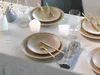 A table setting with plates, cutlery, wine glasses, and candles. Náhľad obrázku produktu