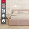 A pink upholstered bed with a headboard and bedding, set against a textured wall with decorative elements. A sidebar on the left displays product features and branding. Produktbild-Vorschau