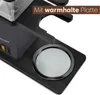 A close-up view of a coffee maker's base, highlighting a warming plate. Produktbild-Vorschau