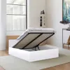 A white bed frame with the mattress lifted, revealing storage space underneath, in a bedroom setting. Produktbild-Vorschau